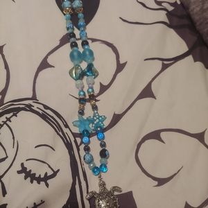 A handmade beaded necklace, inspired by the sea